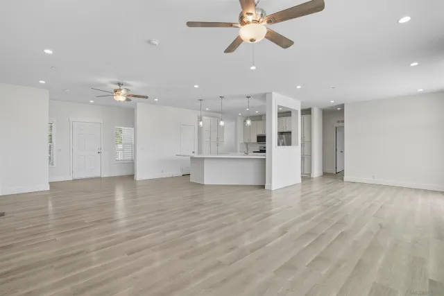 a view of a kitchen with a dishwasher and a refrigerator