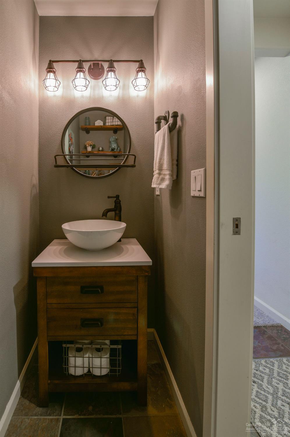 62681 Larkview Road Bend, OR 97701 - Photo 9 of 18 a bathroom with a sink and a mirror