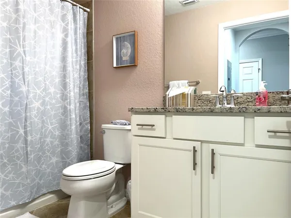 a view of a balcony with furniture