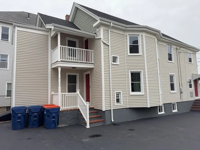 a front view of a house with a large window