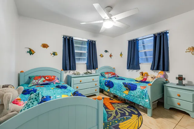 a bedroom with toys and dresser