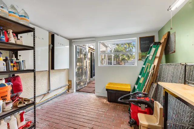 a living room with furniture and a book shelf