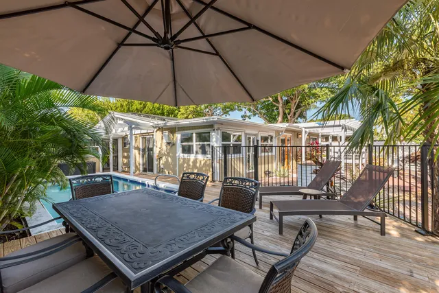 an outdoor space with furniture and umbrella