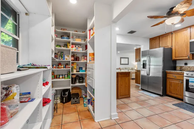 a kitchen with stainless steel appliances a refrigerator and a sink
