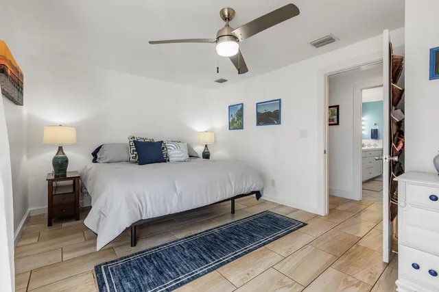 a bedroom with a bed and a walk in closet