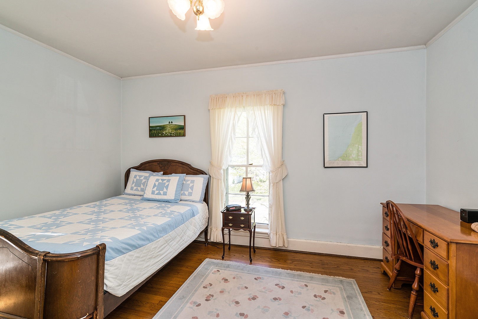 548 Willow Road Winnetka, IL 60093 - Photo 11 of 26 a bedroom with a bed and a table in it