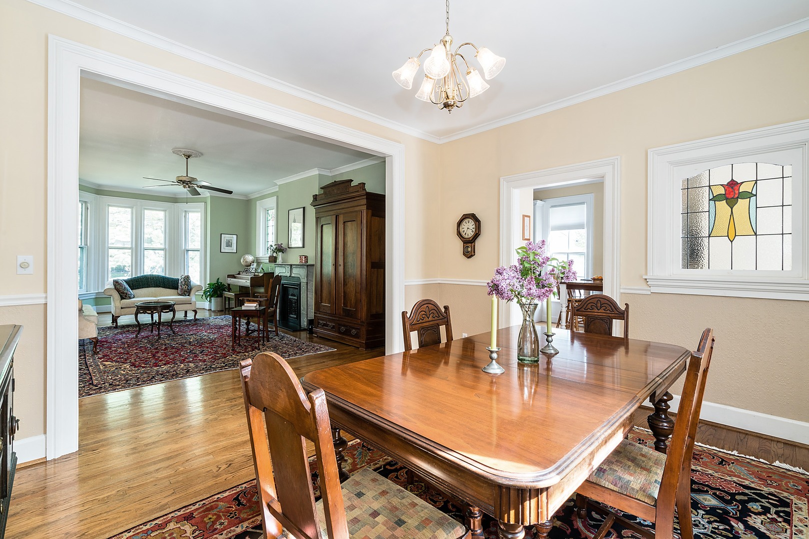 548 Willow Road Winnetka, IL 60093 - Photo 6 of 26 a view of a dining room with furniture and wooden floor