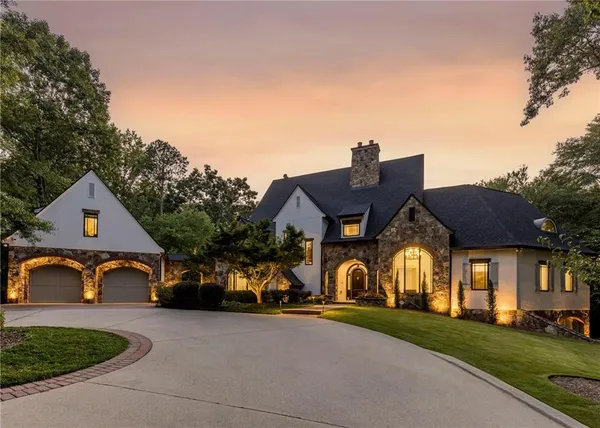 a large kitchen with a table and chairs