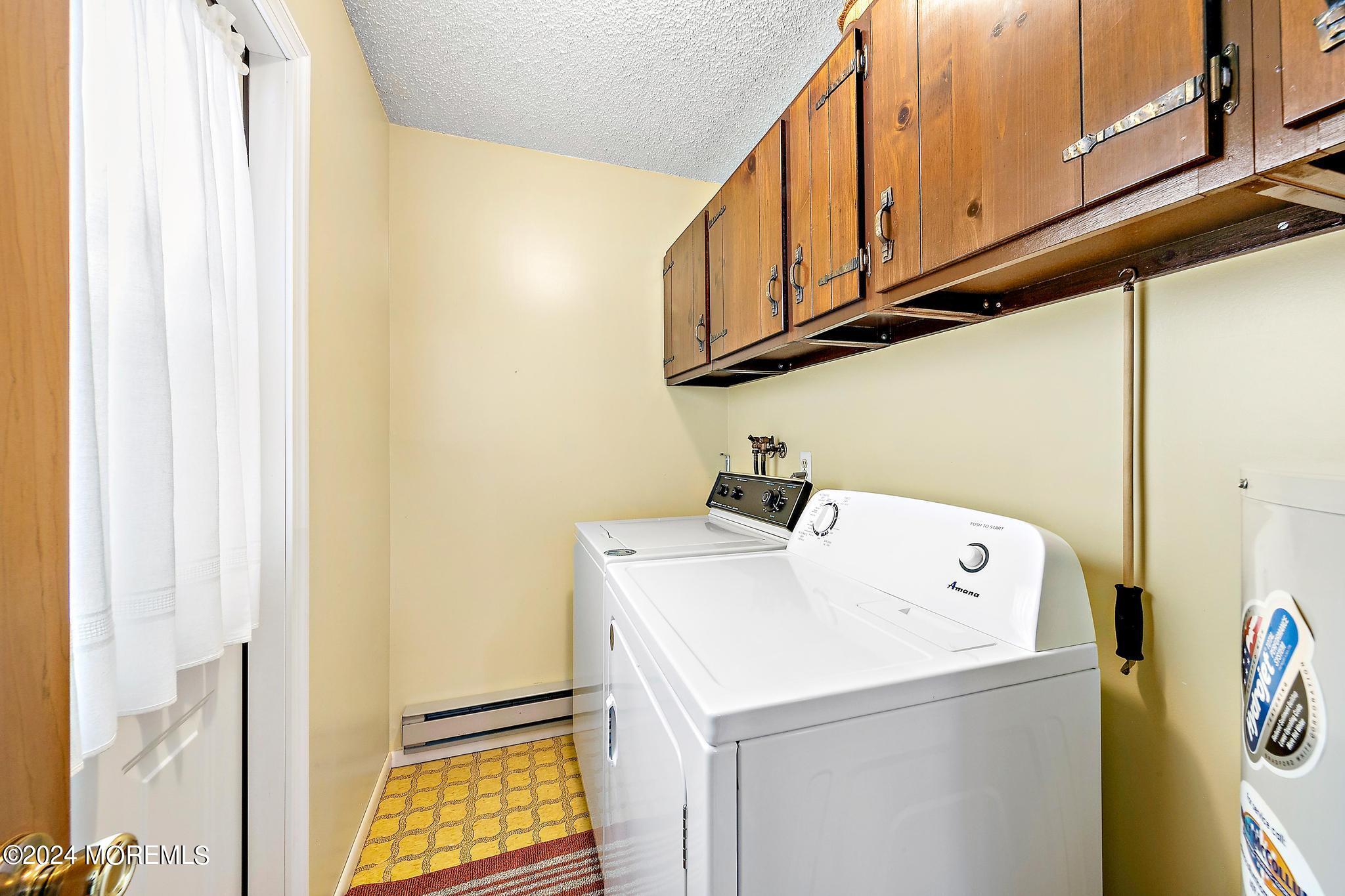 197 Bowline Road Manahawkin, NJ 08050 - Photo 8 of 10 a utility room with dryer and washer