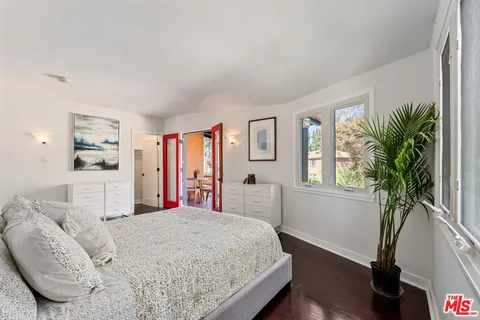 a view of a porch with furniture and a yard