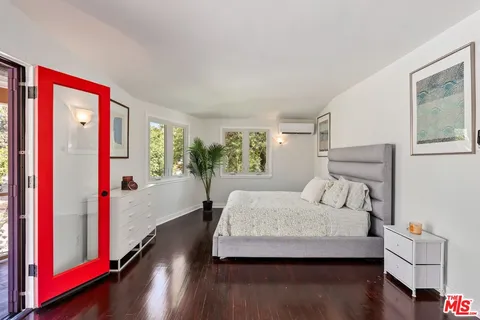 a view of a porch with furniture and wooden floor