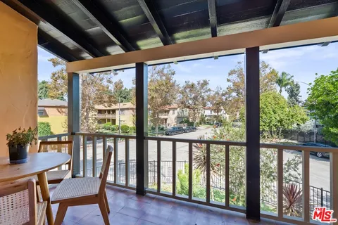 a view of a livingroom with furniture and a potted plant