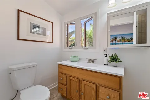 a bedroom with a large bed and a large window