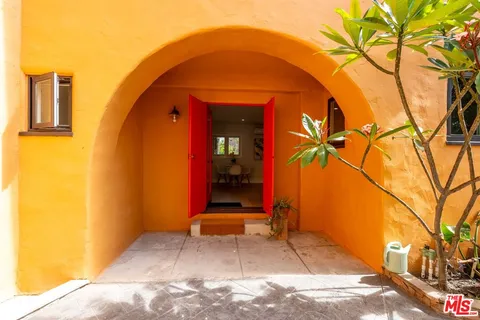 a front view of a house with garden