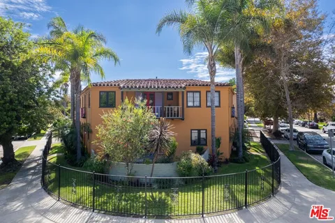 an aerial view of a house with a garden and trees