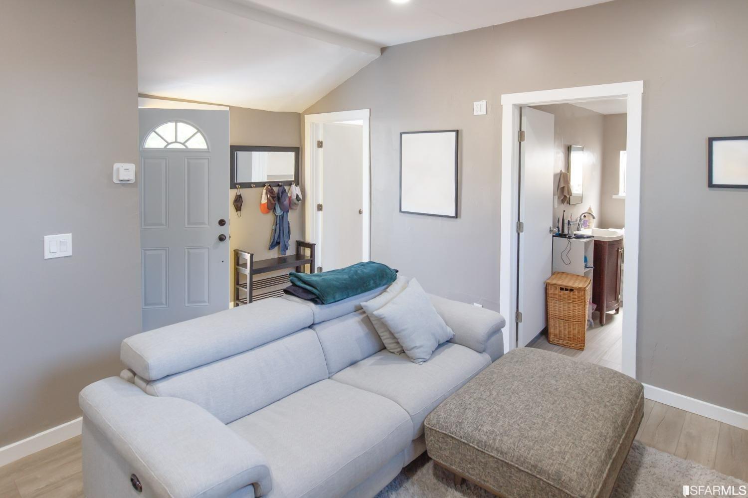1616 Prince Street Berkeley, CA 94703 - Photo 14 of 20 a living room with furniture and a chandelier