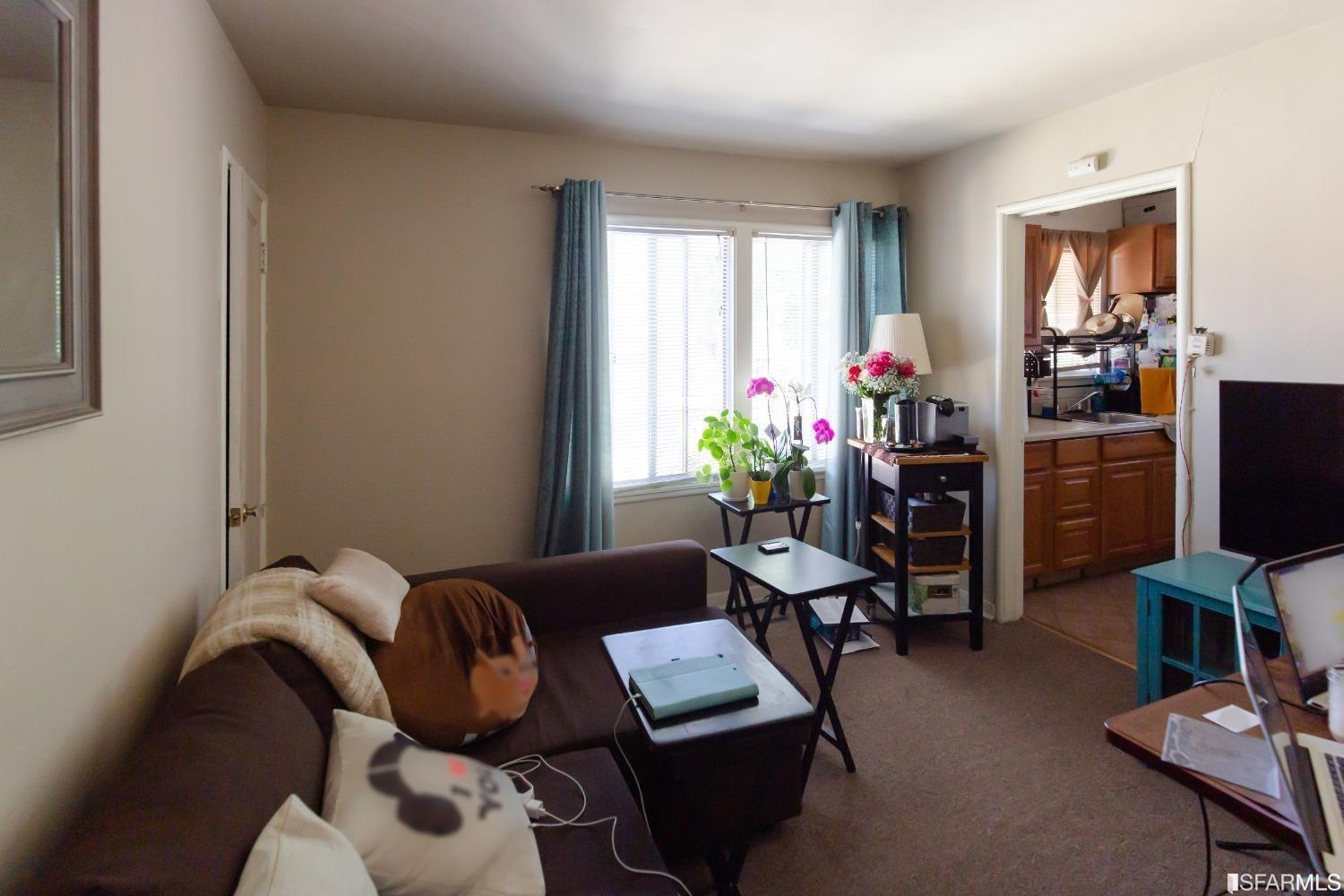 1616 Prince Street Berkeley, CA 94703 - Photo 15 of 20 a living room with furniture and a flat screen tv