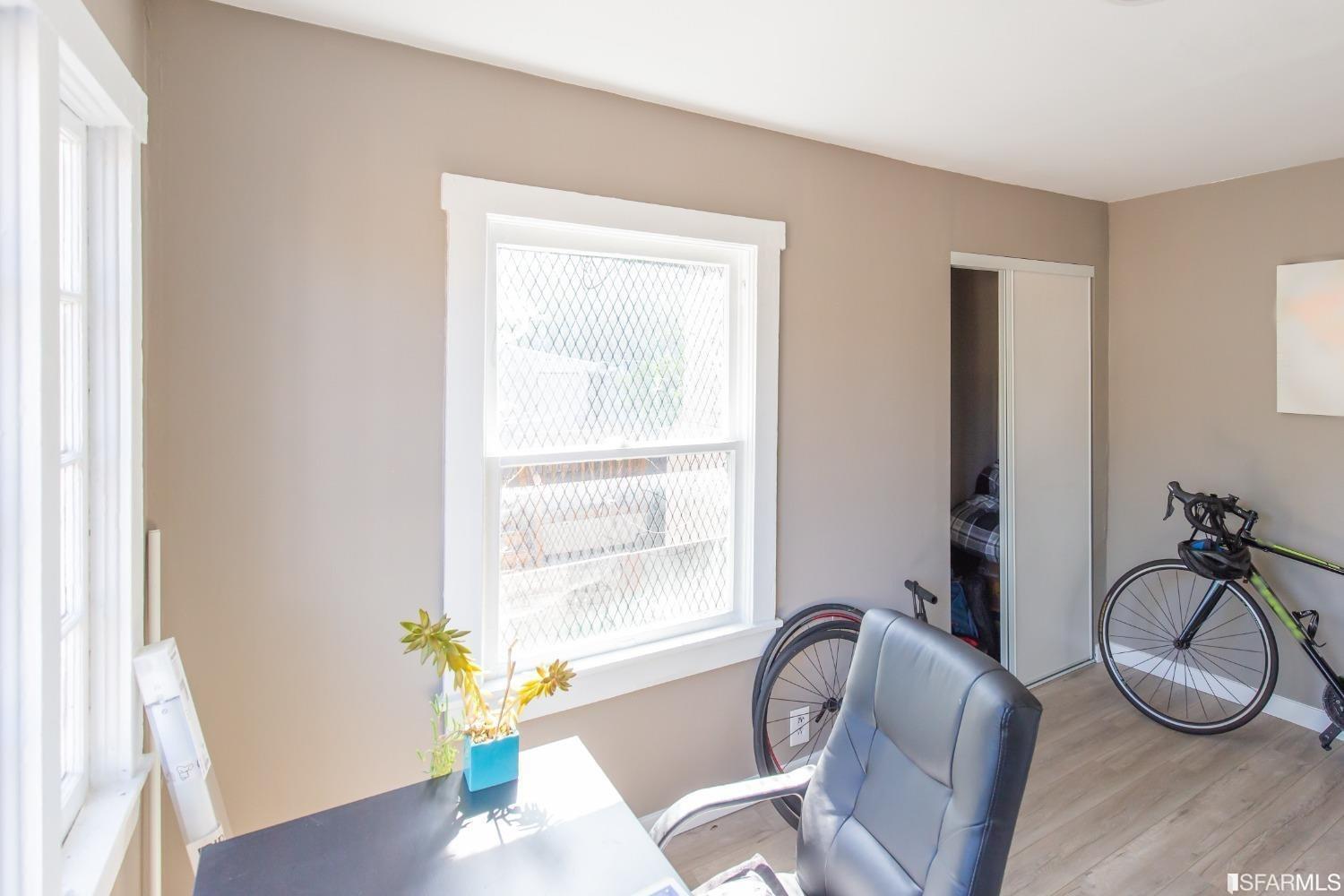 1616 Prince Street Berkeley, CA 94703 - Photo 18 of 20 a view of a livingroom with furniture window and wooden floor