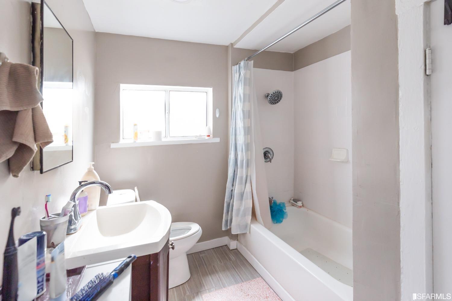 1616 Prince Street Berkeley, CA 94703 - Photo 5 of 20 a bathroom with a sink toilet and bathtub