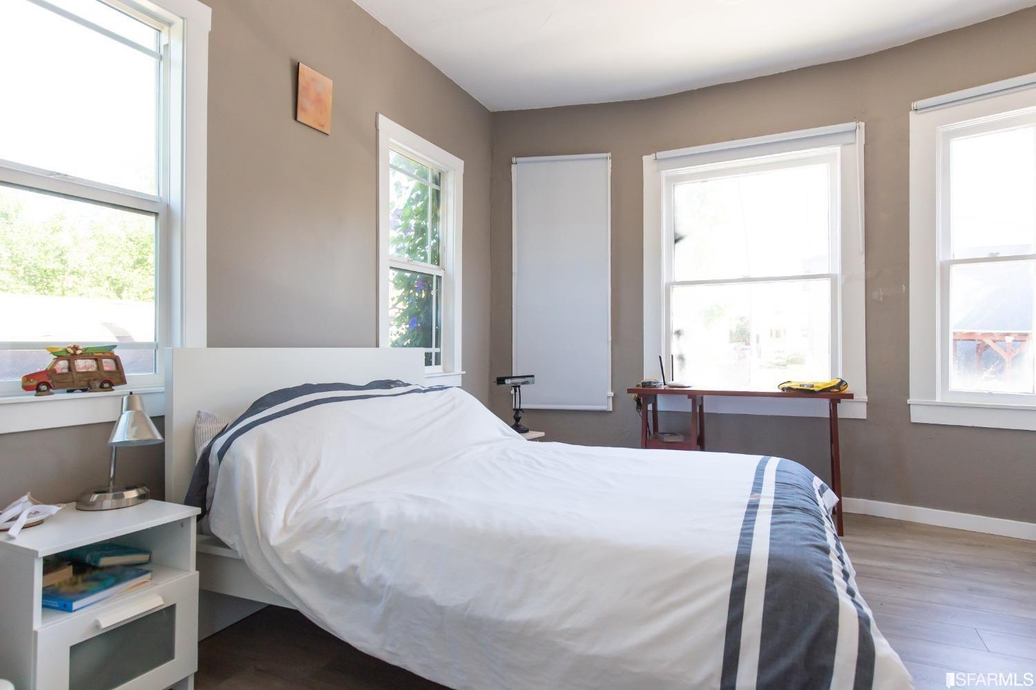 1616 Prince Street Berkeley, CA 94703 - Photo 7 of 20 a bedroom with a bed and a window