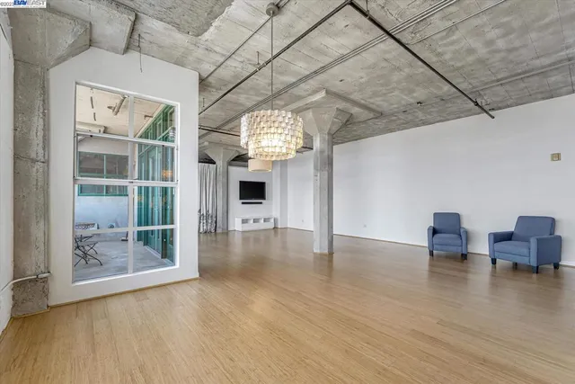 a view of a livingroom with wooden floor