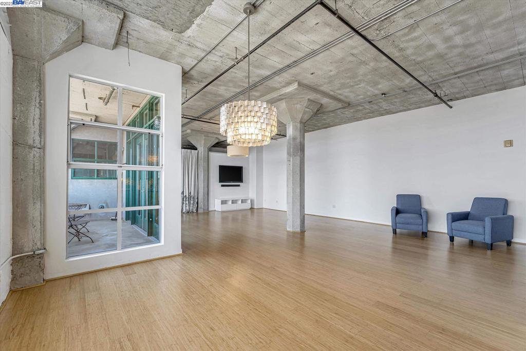 737 2nd Street, Unit 310 Oakland, CA 94607 - Photo 15 of 29 a view of livingroom with furniture wooden floor and windows