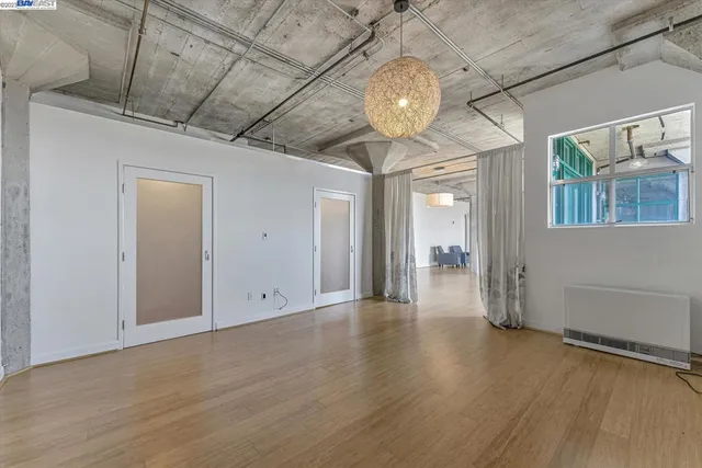 an empty room with wooden floor