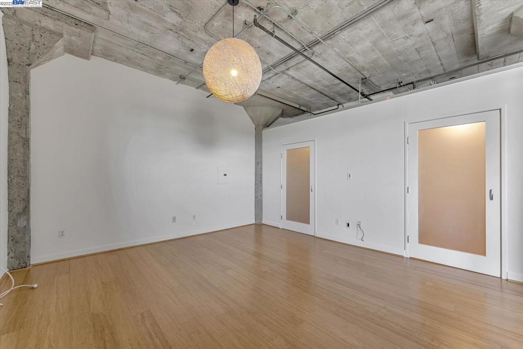 737 2nd Street, Unit 310 Oakland, CA 94607 - Photo 18 of 29 an empty room with wooden floor