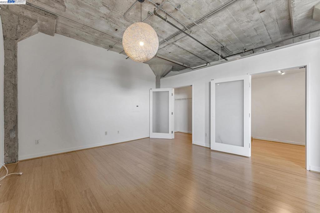 737 2nd Street, Unit 310 Oakland, CA 94607 - Photo 19 of 29 a view of an empty room with wooden floor