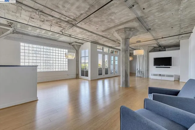 a view of a livingroom with an empty space and a flat screen tv