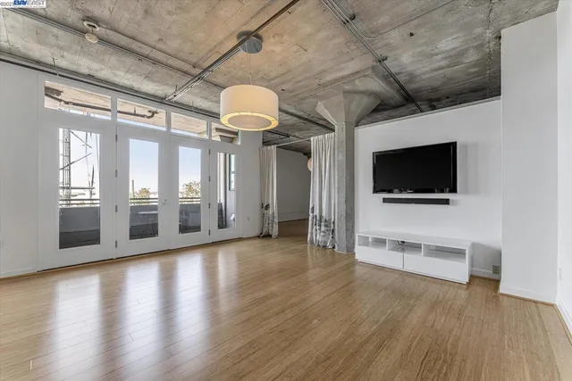 a large kitchen with a table and chairs