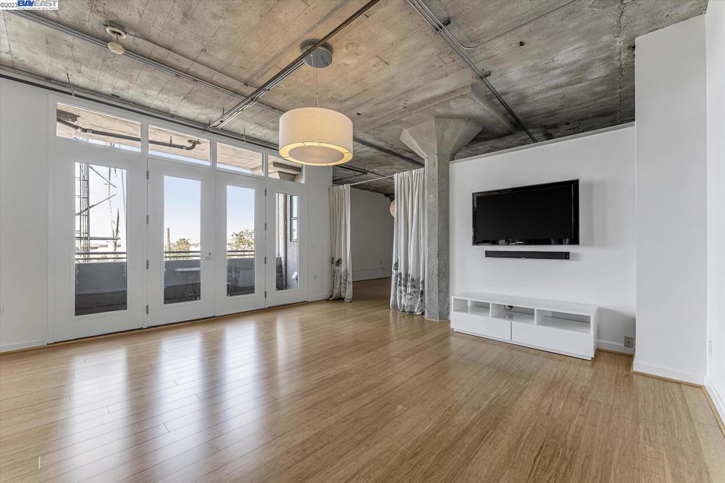 737 2nd Street, Unit 310 Oakland, CA 94607 - Photo 9 of 29 a view of a livingroom with an empty space and a flat screen tv
