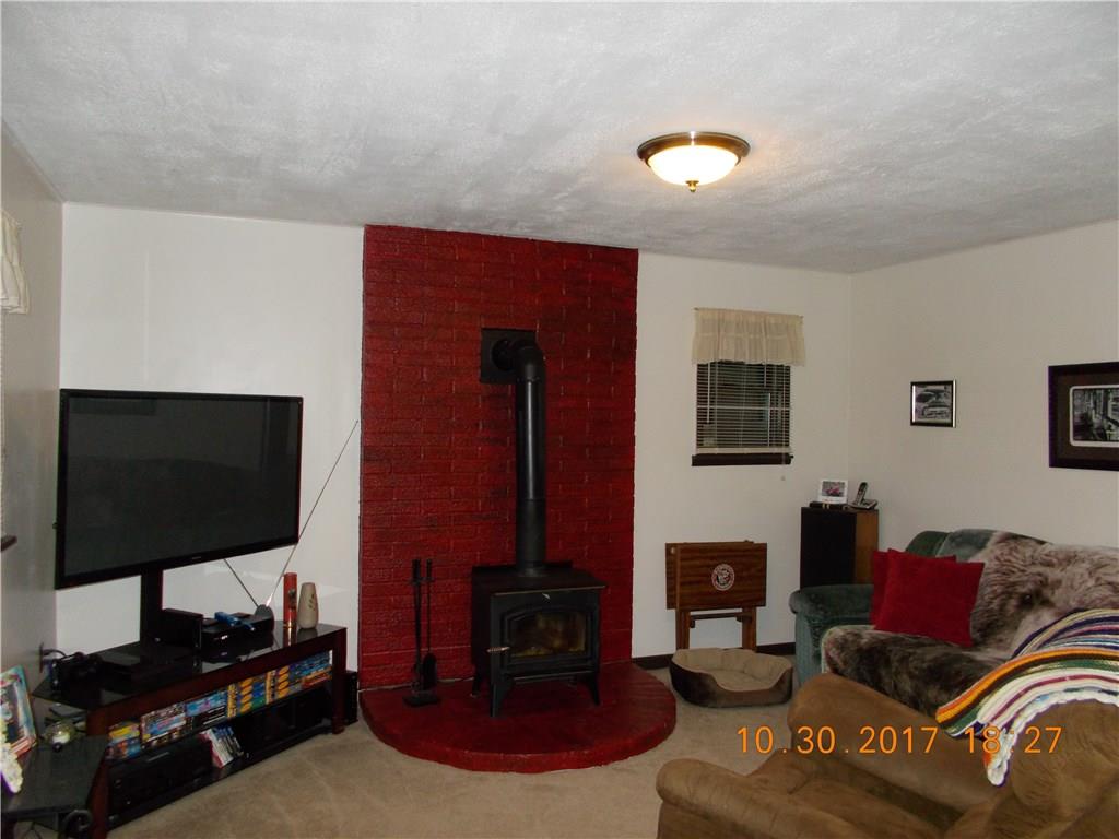 547 Pollock Store Road Volant, PA 16156 - Photo 6 of 13 Living room w/ wood burning stove.