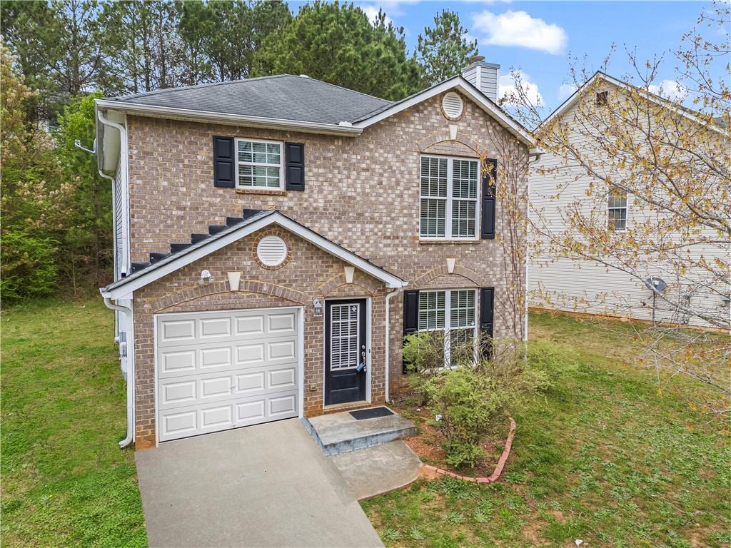 4030 Riverside Parkway Decatur, GA 30034 - Photo 1 of 1 a front view of a house with garden