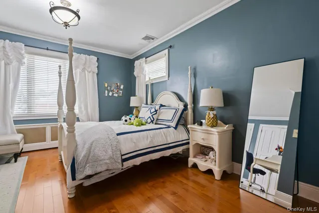 a bed room with a bed and a window