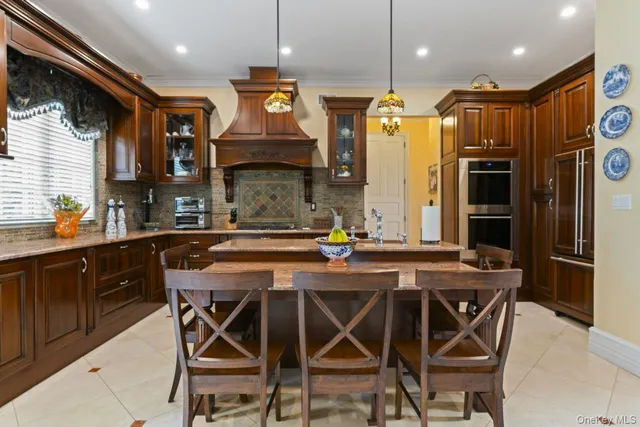 a kitchen with a table and chairs in it