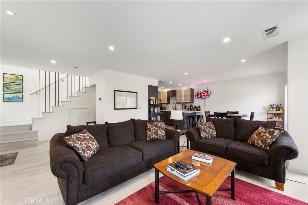 11744 Moorpark Street, Unit F Studio City, CA 91604 - Photo 1 of 1 a living room with furniture and a couch