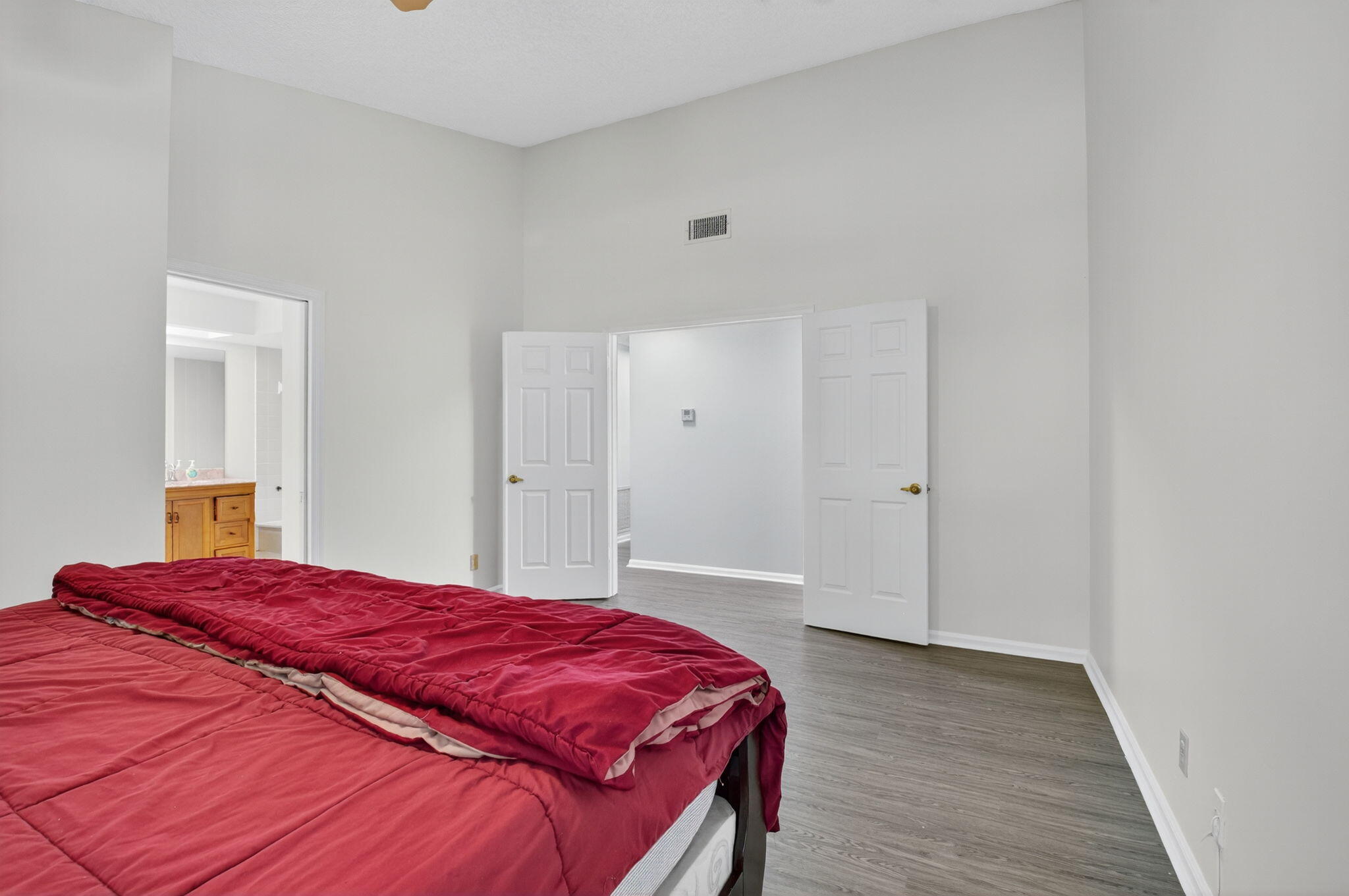 5530 Coach House Circle, Unit E Boca Raton, FL 33486 - Photo 15 of 40 a bedroom with a bed and a closet