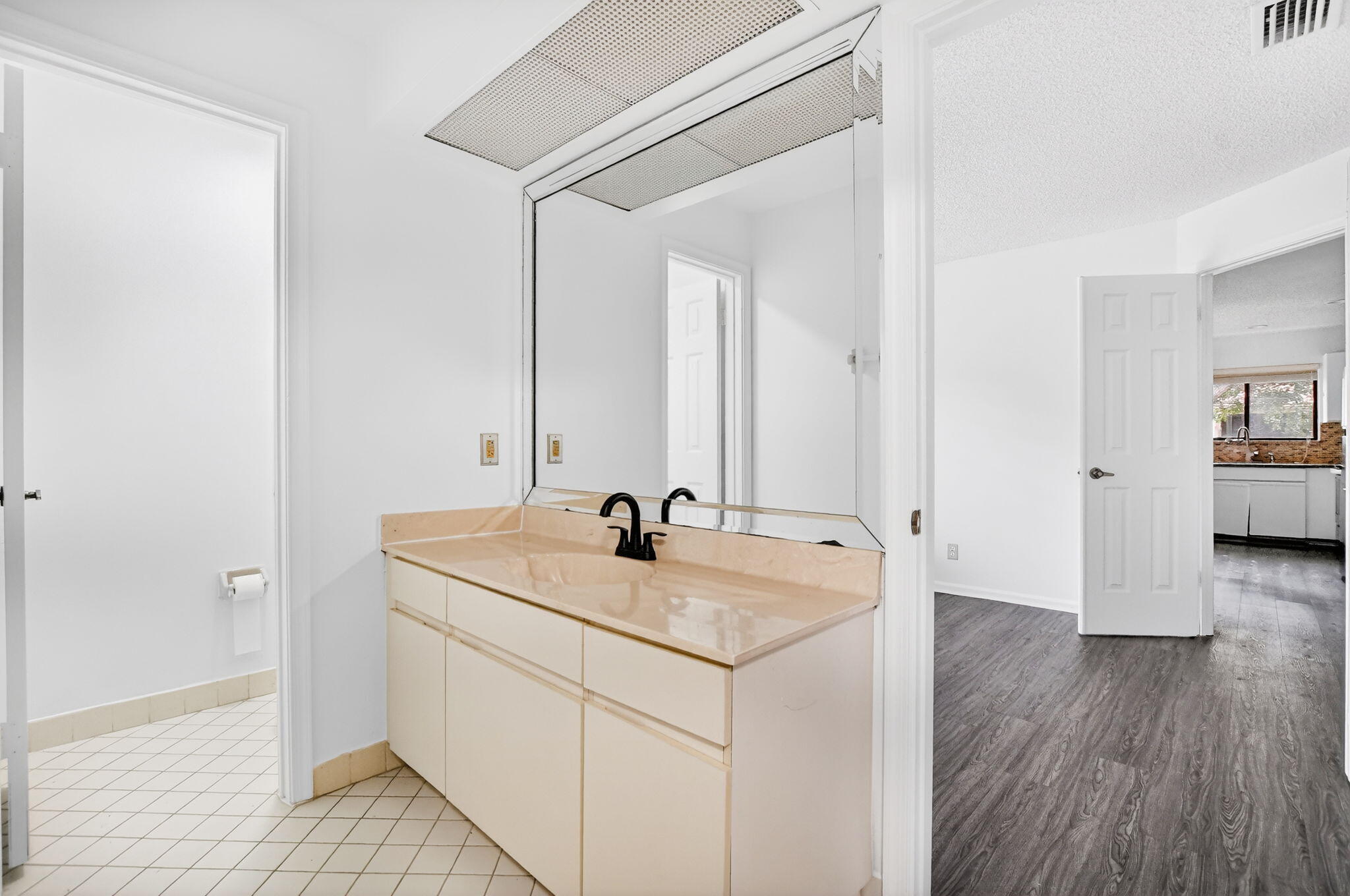 5530 Coach House Circle, Unit E Boca Raton, FL 33486 - Photo 20 of 40 a bathroom with a sink and a mirror