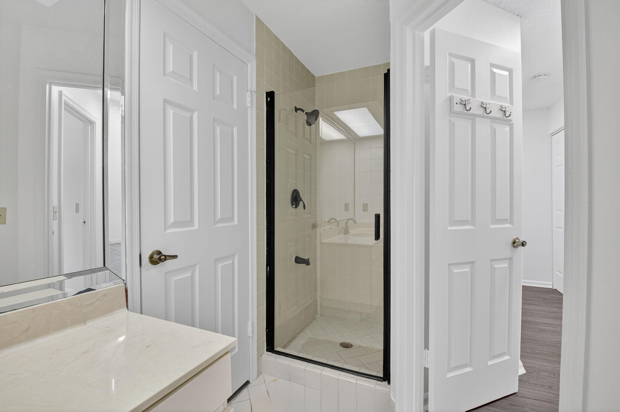 5530 Coach House Circle, Unit E Boca Raton, FL 33486 - Photo 22 of 40 a bathroom with a shower and a sink