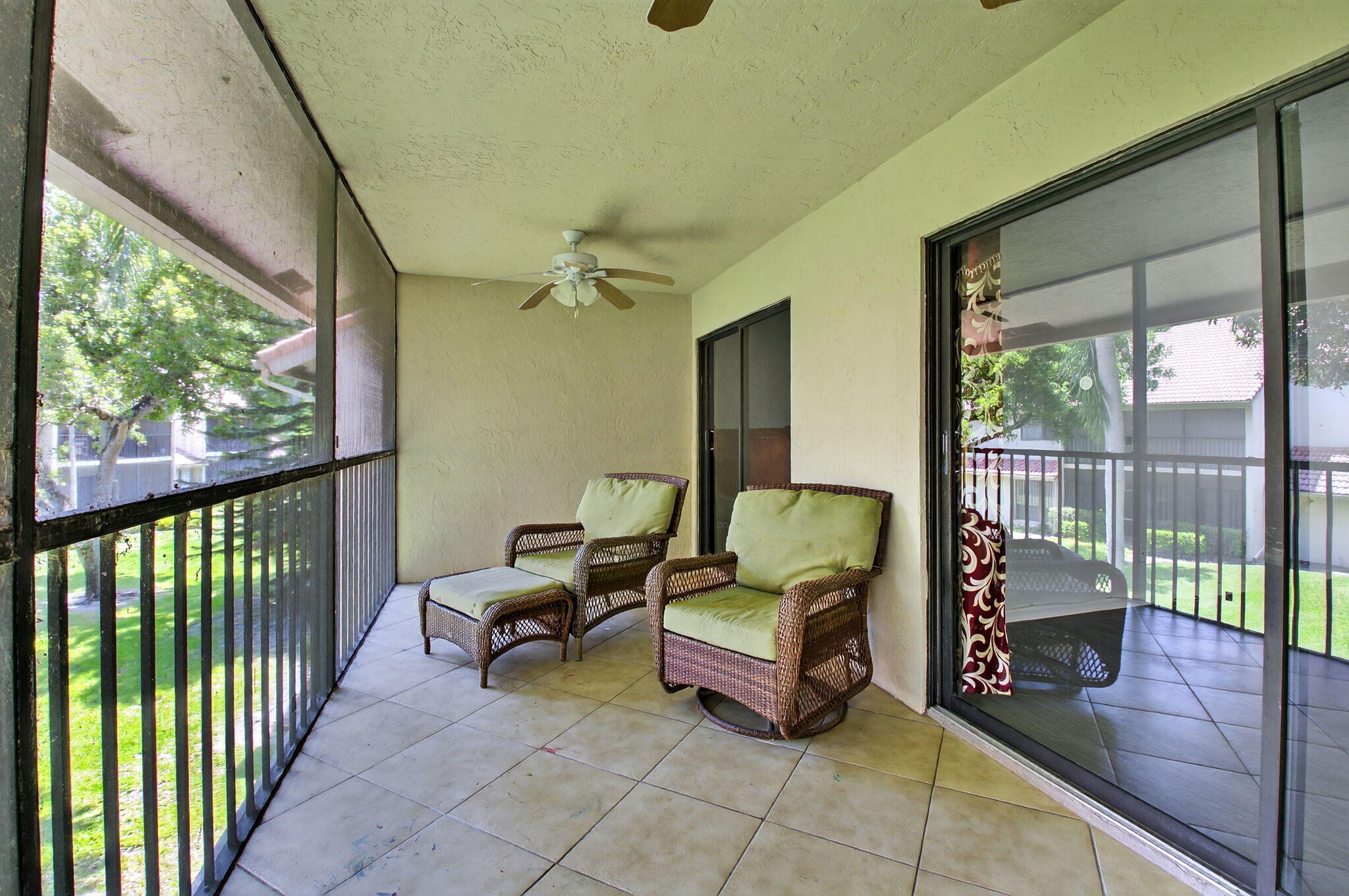 5530 Coach House Circle, Unit E Boca Raton, FL 33486 - Photo 27 of 40 a balcony with furniture and a potted plant