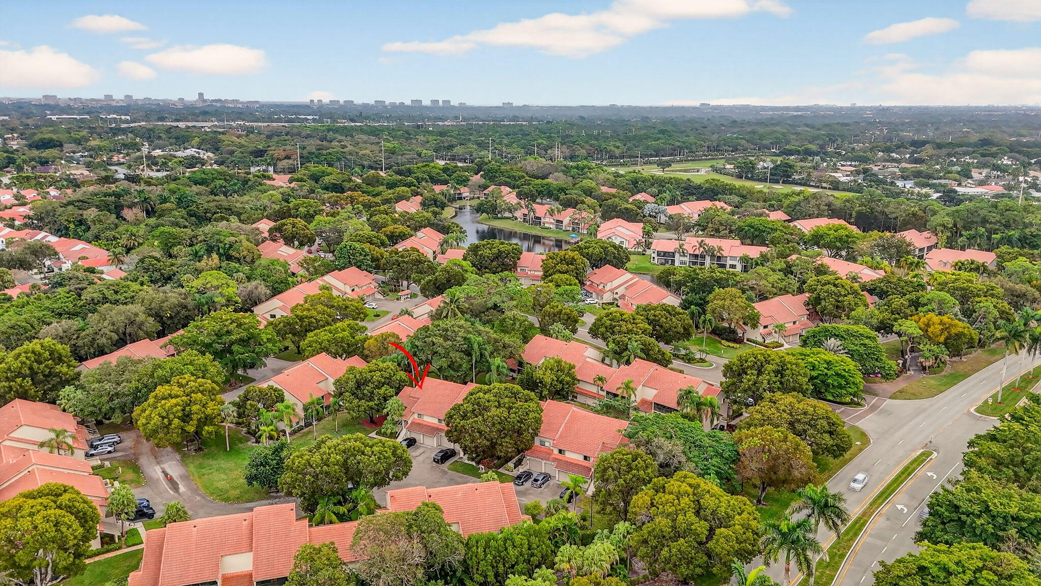 5530 Coach House Circle, Unit E Boca Raton, FL 33486 - Photo 37 of 40 an aerial view of residential houses with outdoor space and trees