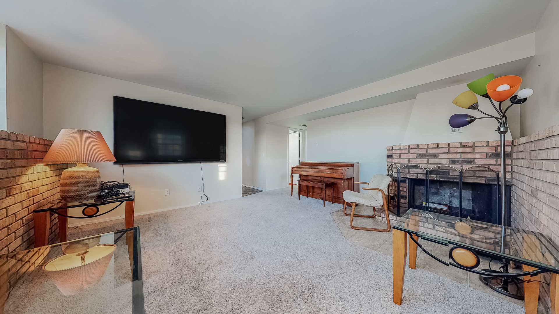 34 Aldon Road Montgomery, IL 60538 - Photo 16 of 20 a living room with furniture a flat screen tv and a fireplace