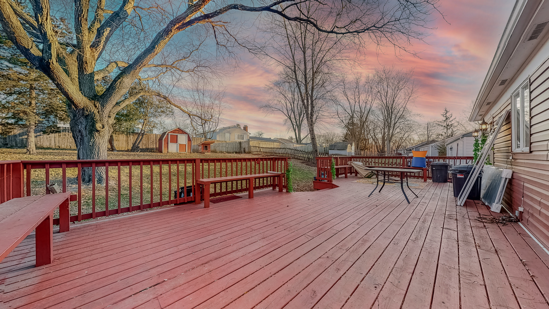 34 Aldon Road Montgomery, IL 60538 - Photo 19 of 20 a view of a roof deck with table and chairs wooden floor and fence