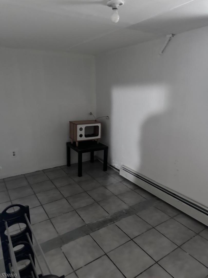 152 Jaques Street Elizabeth, NJ 07201 - Photo 17 of 23 a view of wooden floor