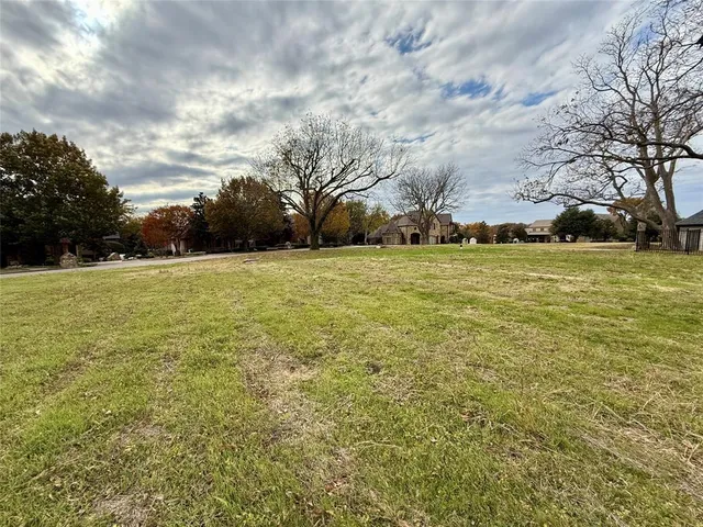 a view of outdoor space with yard and trees