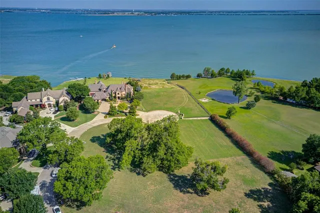 an aerial view of a houses with a yard