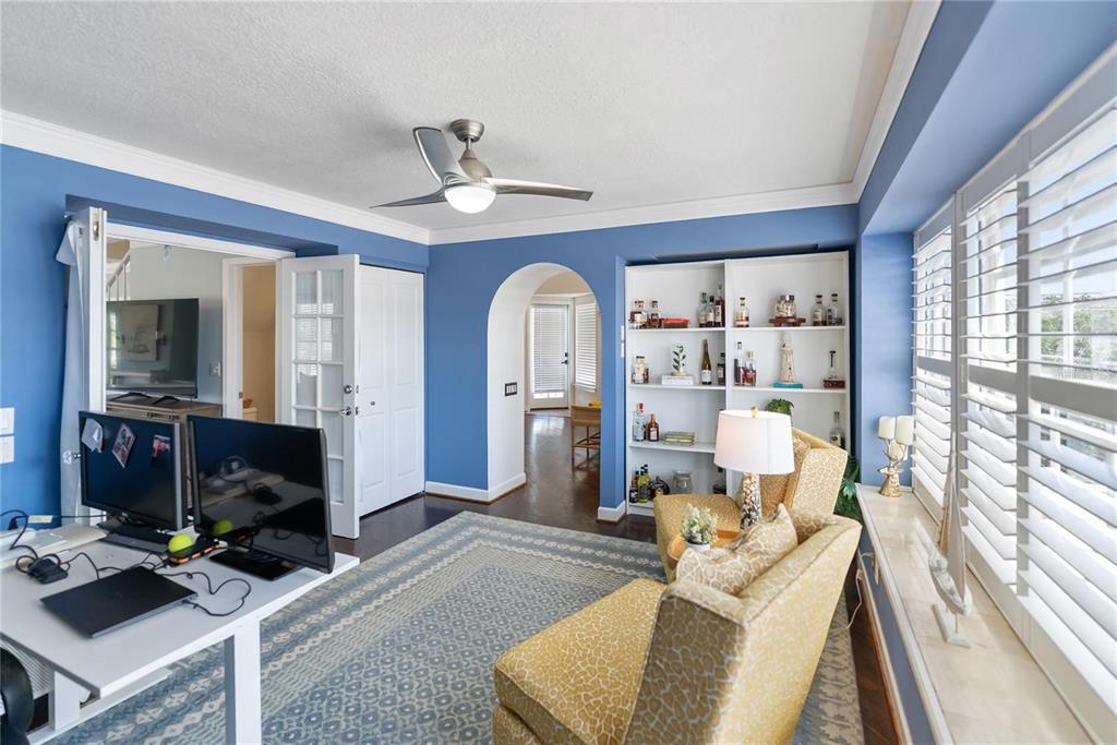 861 Nectar Road Venice, FL 34293 - Photo 26 of 74 a living room with furniture a fireplace and a large window