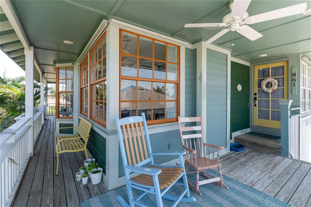 861 Nectar Road Venice, FL 34293 - Photo 7 of 74 a porch area with table and chairs