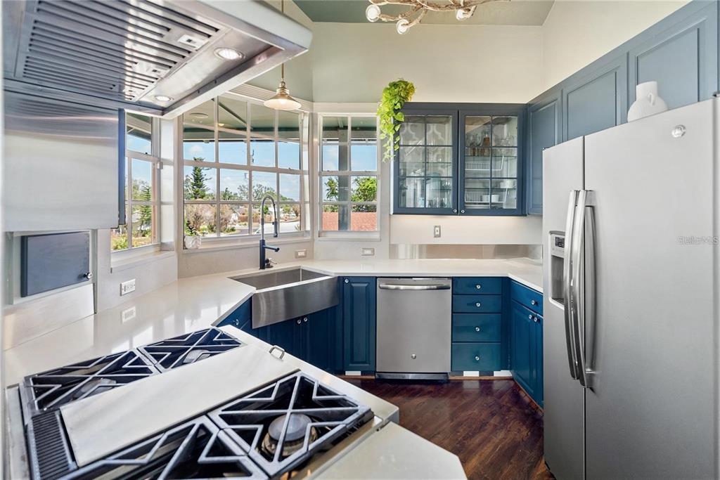 861 Nectar Road Venice, FL 34293 - Photo 8 of 74 a kitchen with a refrigerator and a stove top oven